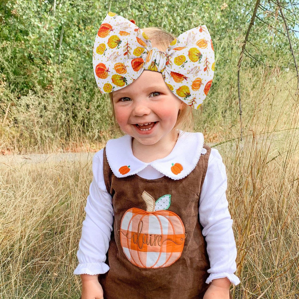 YanJie pumpkin printed headband; adjustable fit holds gently in place