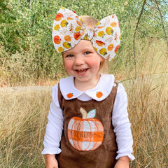 YanJie pumpkin printed headband; adjustable fit holds gently in place