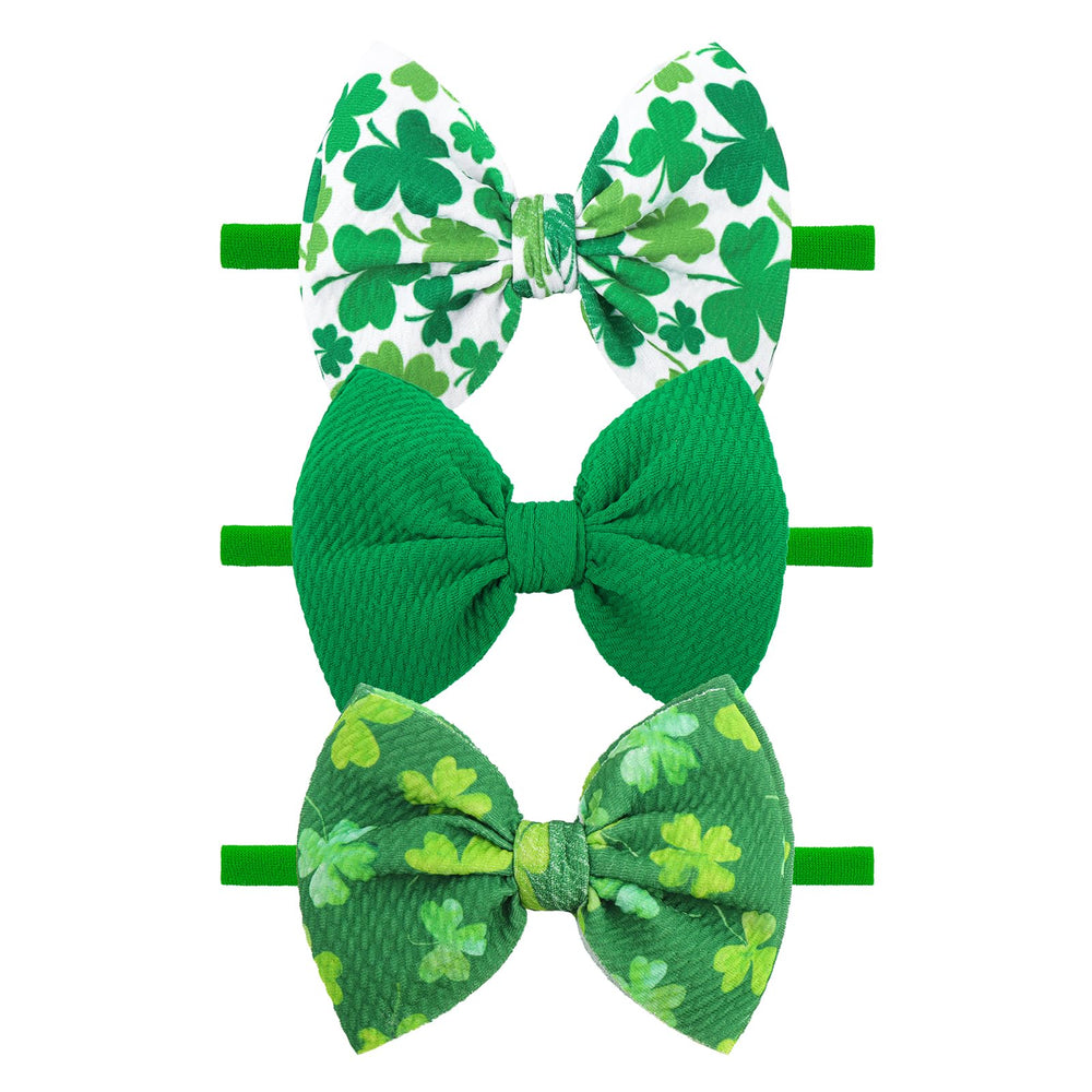 YanJie St. Patrick's Day headband with green bows for adorable newborn photos.