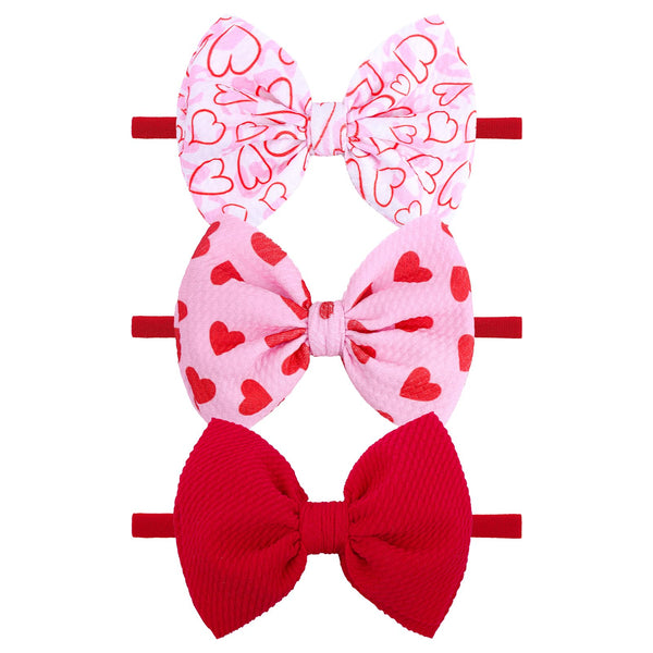 YanJie valentines heart headband in pink for babies with a soft nylon band.