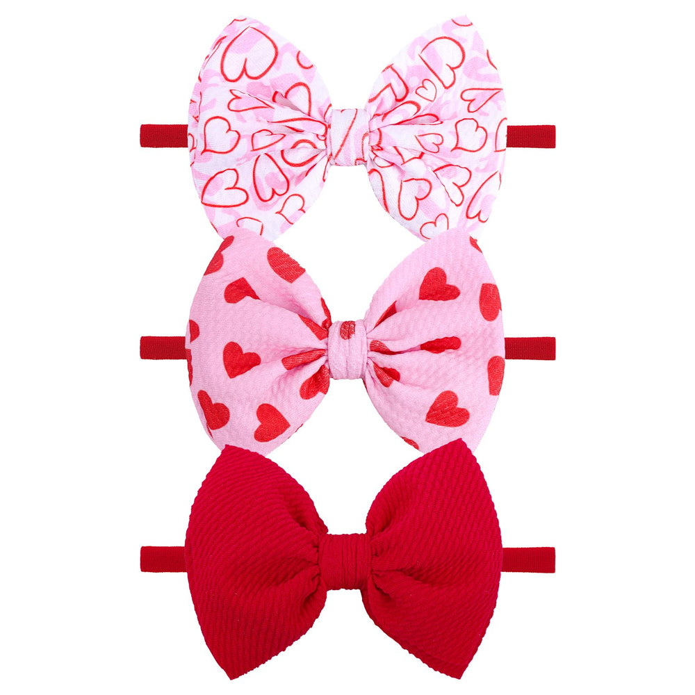 YanJie valentines heart headband in pink for babies with a soft nylon band.
