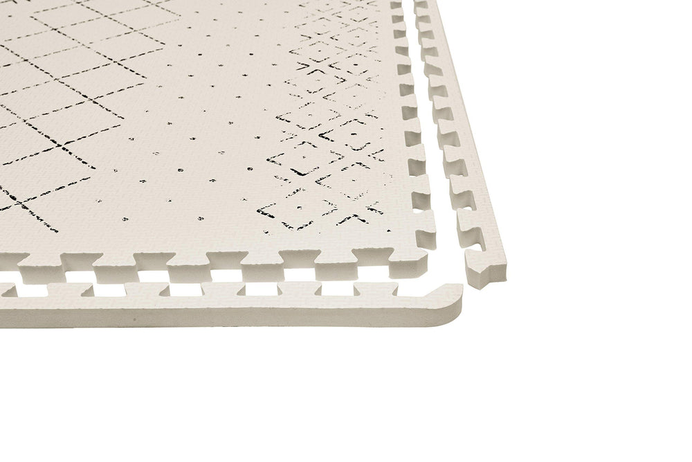 Yay! Mats Carter Mudcloth Tan design adds modern nursery flair