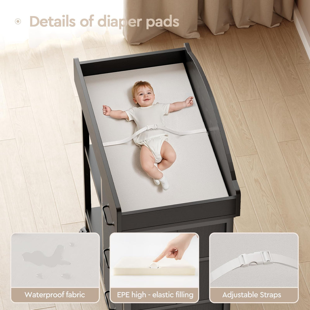 Changing pad area ready for baby care on YeTom black dresser