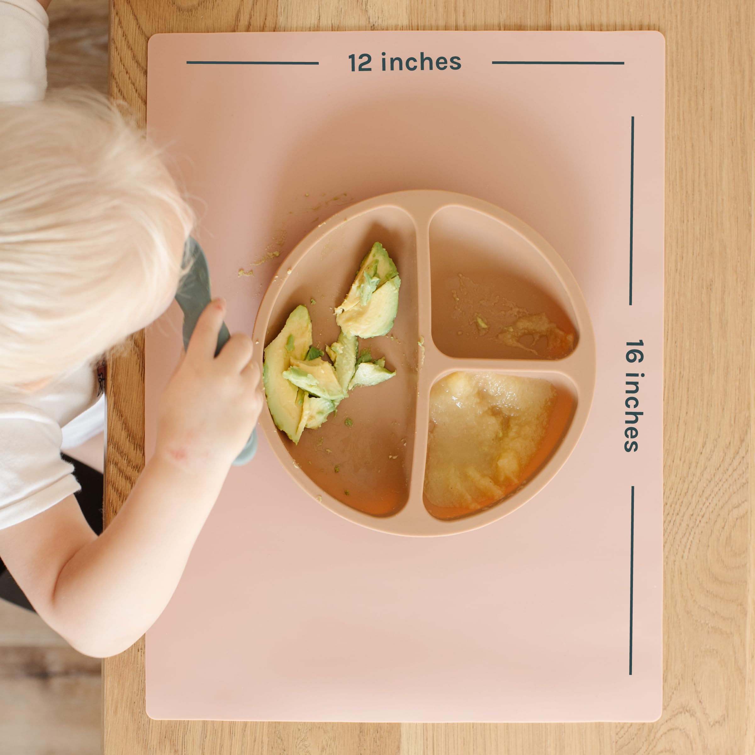 Yeah Baby Goods Desert Sage placemat on a dining table setup for family meals.
