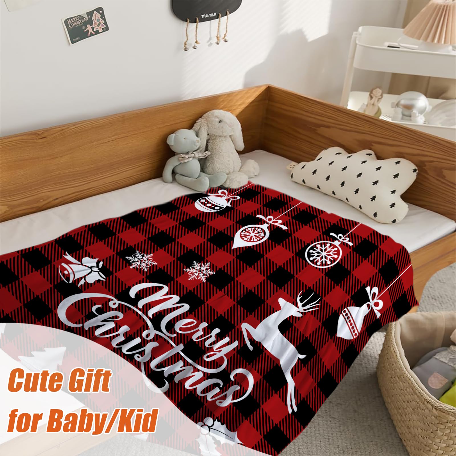 YeeJu toddler nestled with red plaid blanket during quiet reading.
