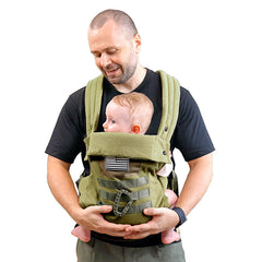 YESYBC baby carrier with foldable headrest shown during a stroll for added neck support.