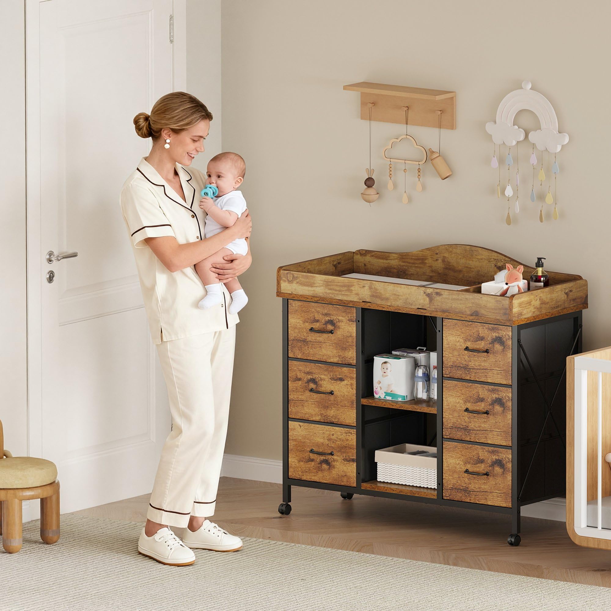YeTom Yetom 6-drawer dresser beneath the changing table for ample storage.