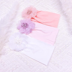 Close-up of handmade white flower accents on the Yheahin headband