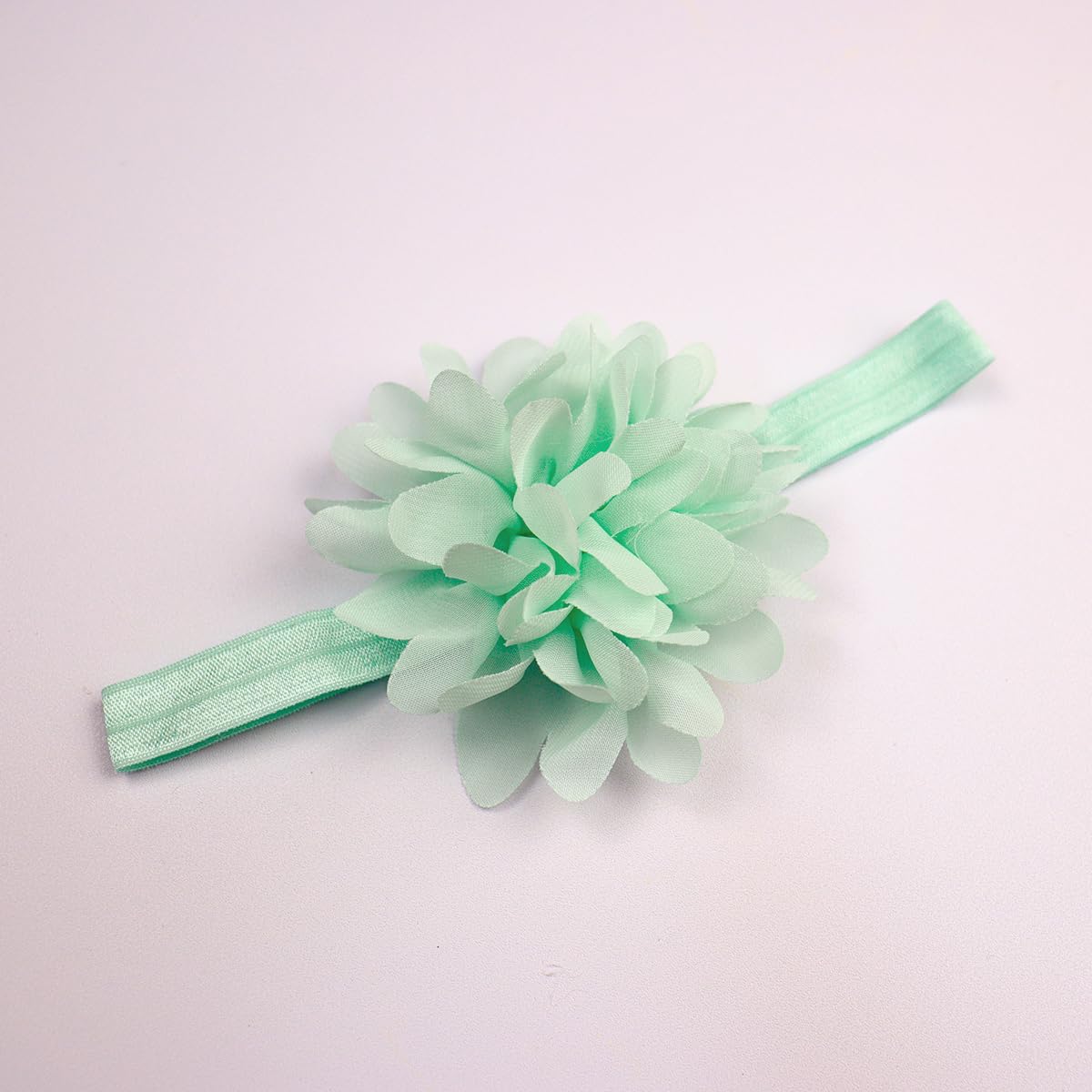 Yheahin green infant headband—soft, non-marking band ideal for long wear.