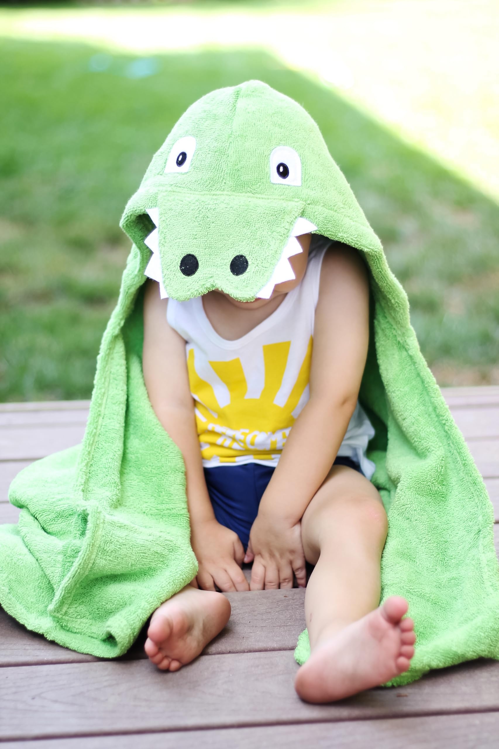 Appliqued facial features and teeth add charm to the drying routine.