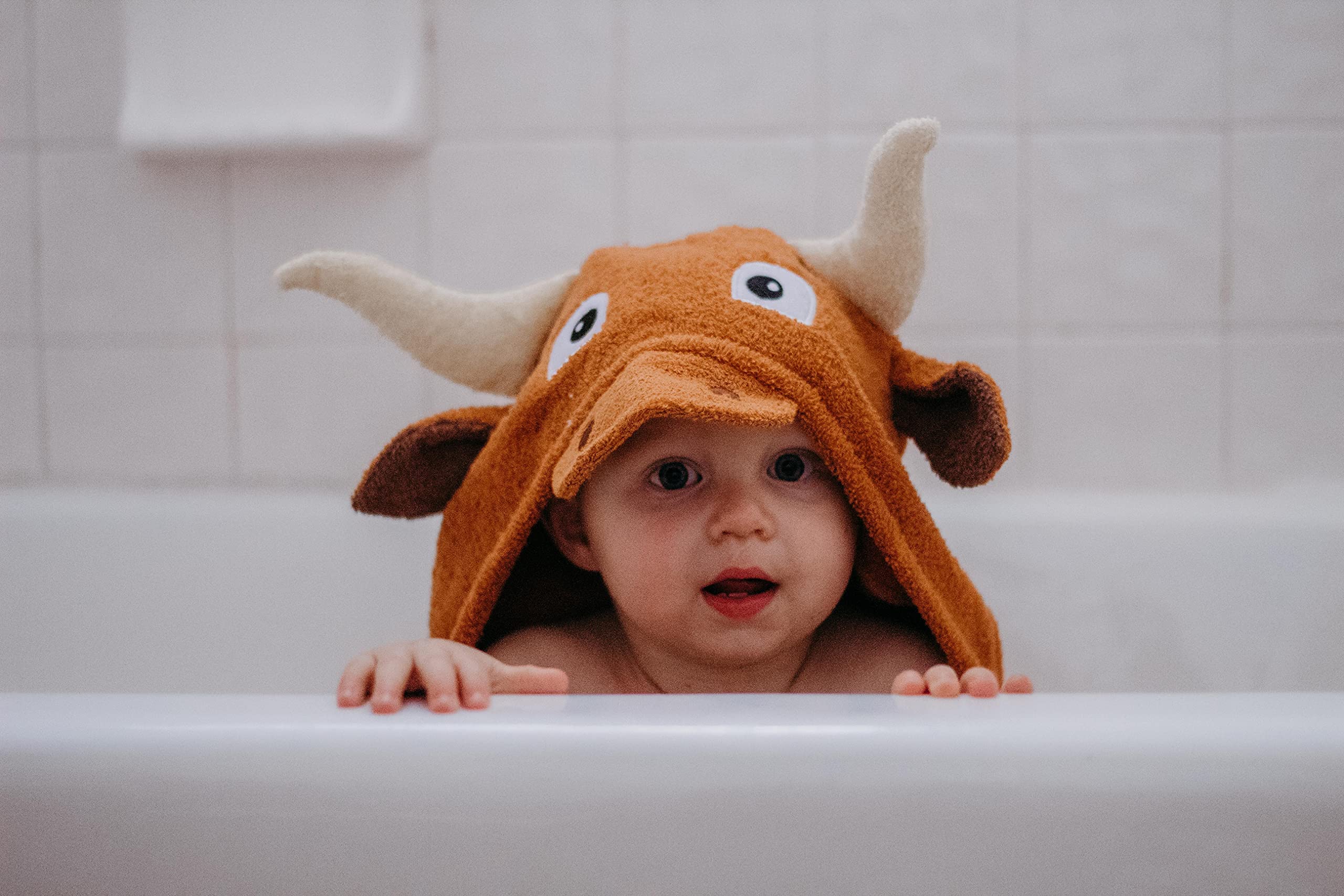 Yikes Twins hooded towel with horn detail for playful bath time