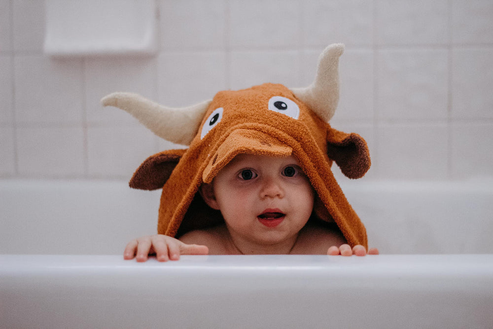 Yikes Twins hooded towel with horn detail for playful bath time
