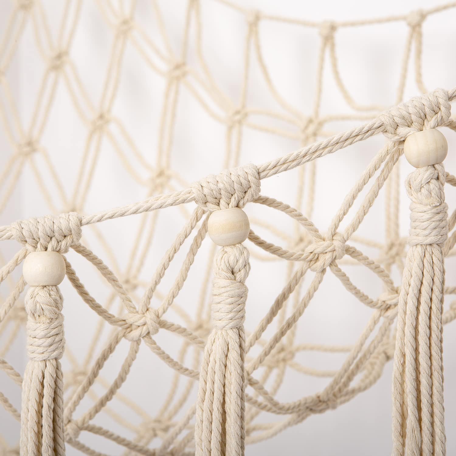 YKBU macrame toy organizer with tassels enhances nursery storage visually