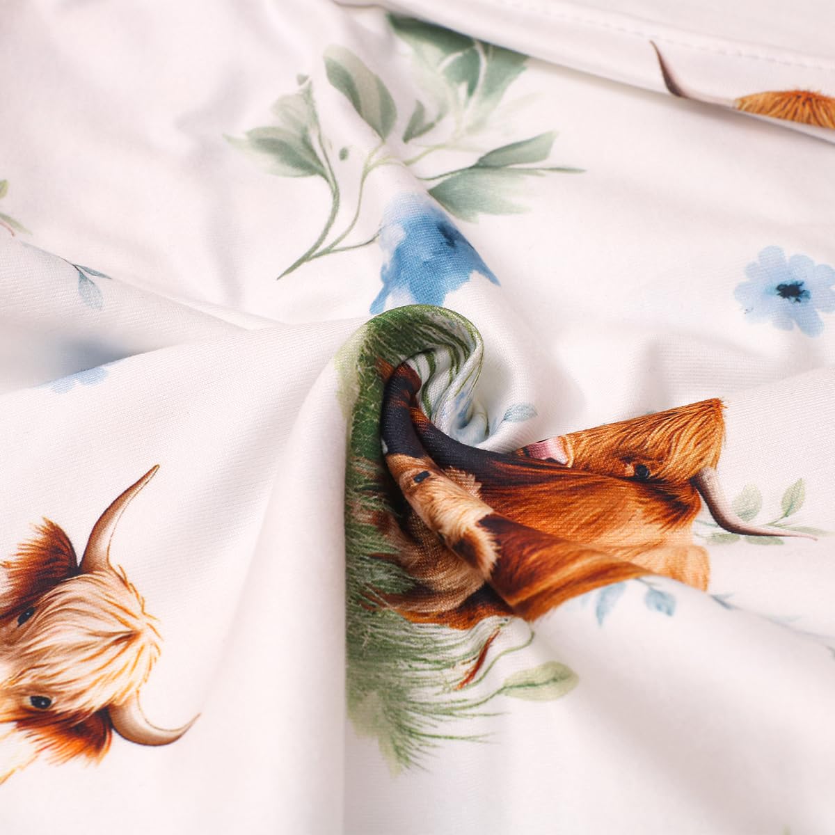 Ylsteed Highland Cow swaddle blanket blue in nursery display, soft comfort during naps