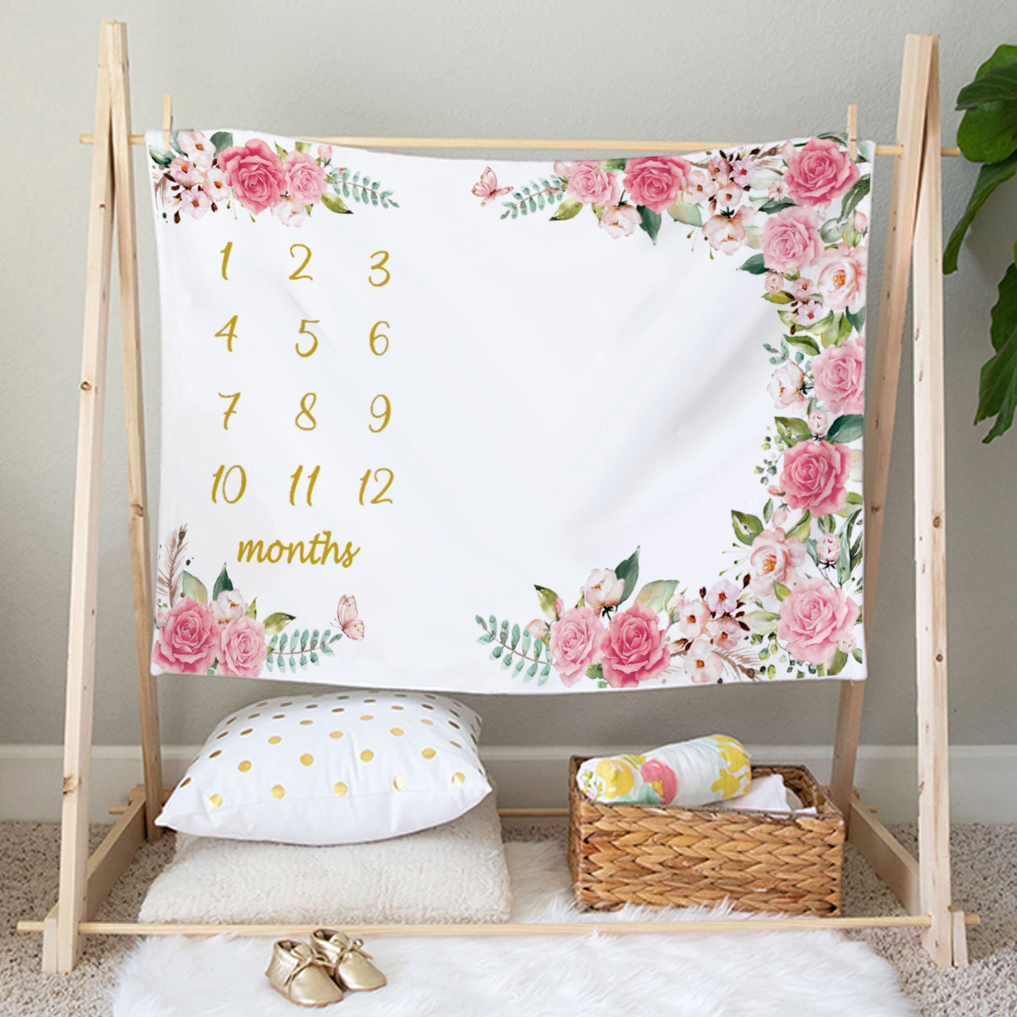 Yokakio floral wreath detail enhances romantic baby photo setups.
