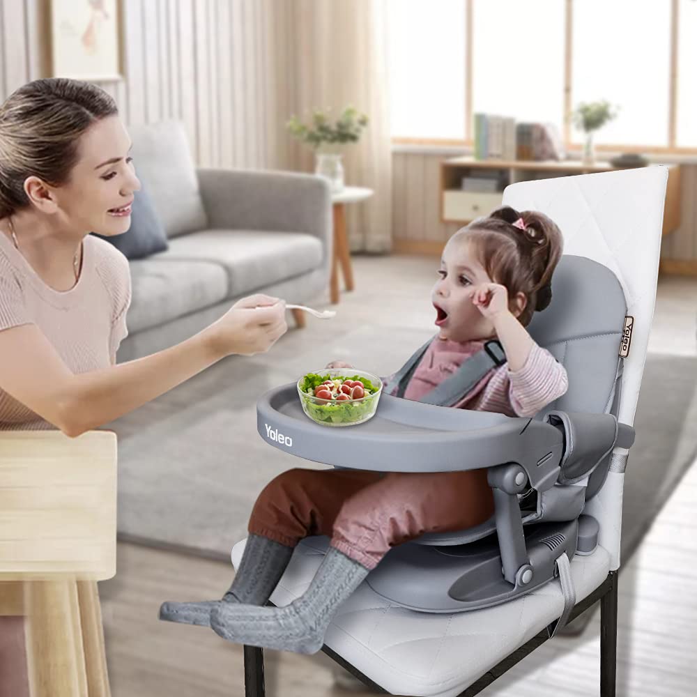 YOLEO booster attached to chair for secure dining