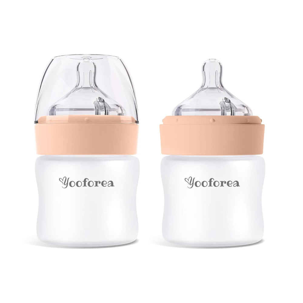 YOOFOREA silicone-coated glass baby bottle with anti-colic venting for smoother feeds.
