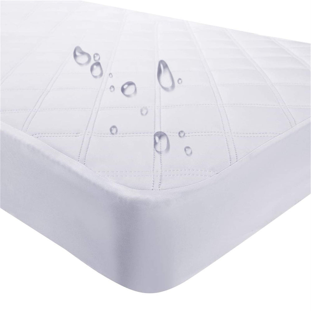 Yoofoss crib mattress protector rolled for easy setup and protection against spills