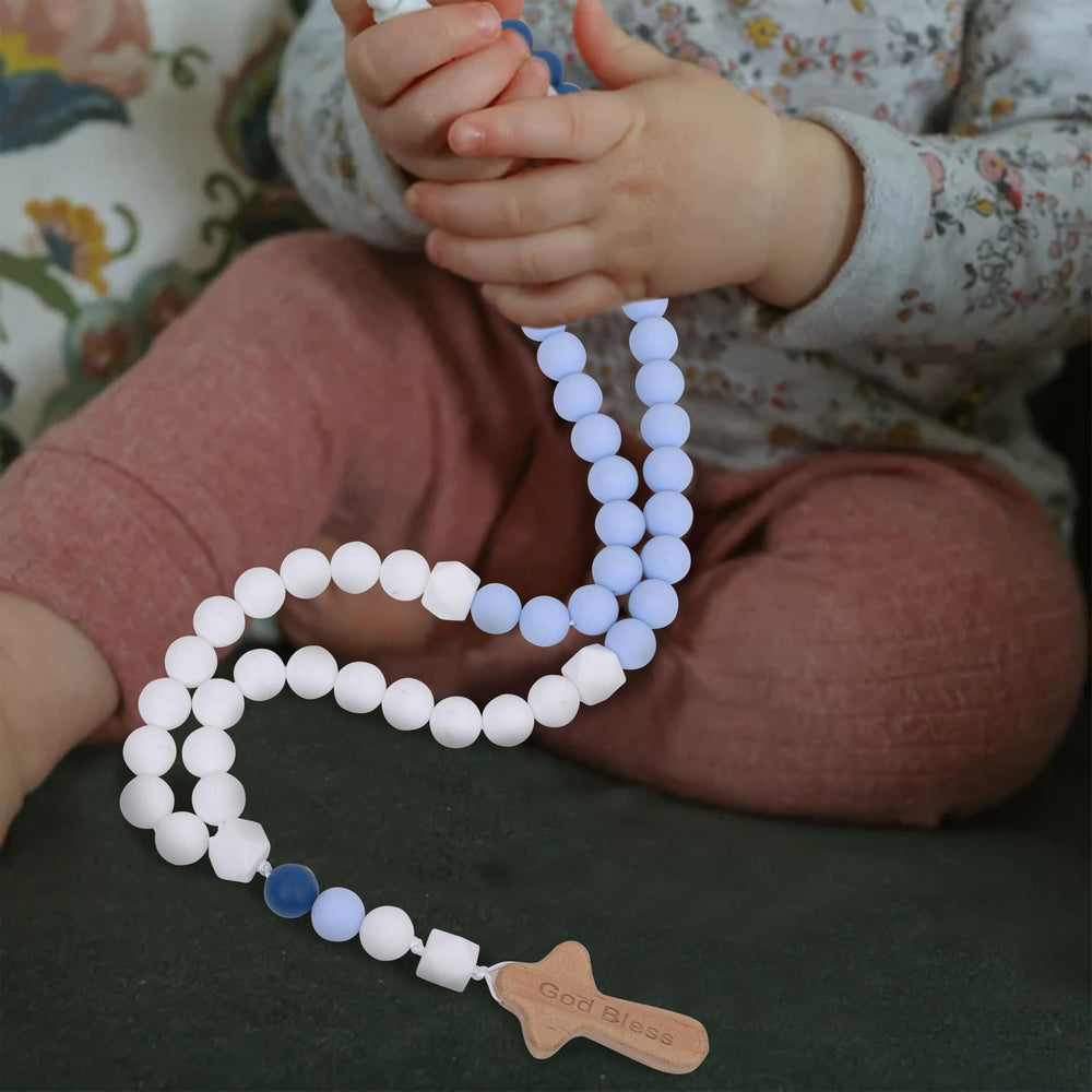 YOUAME blue themed rosary complements baptism decor.