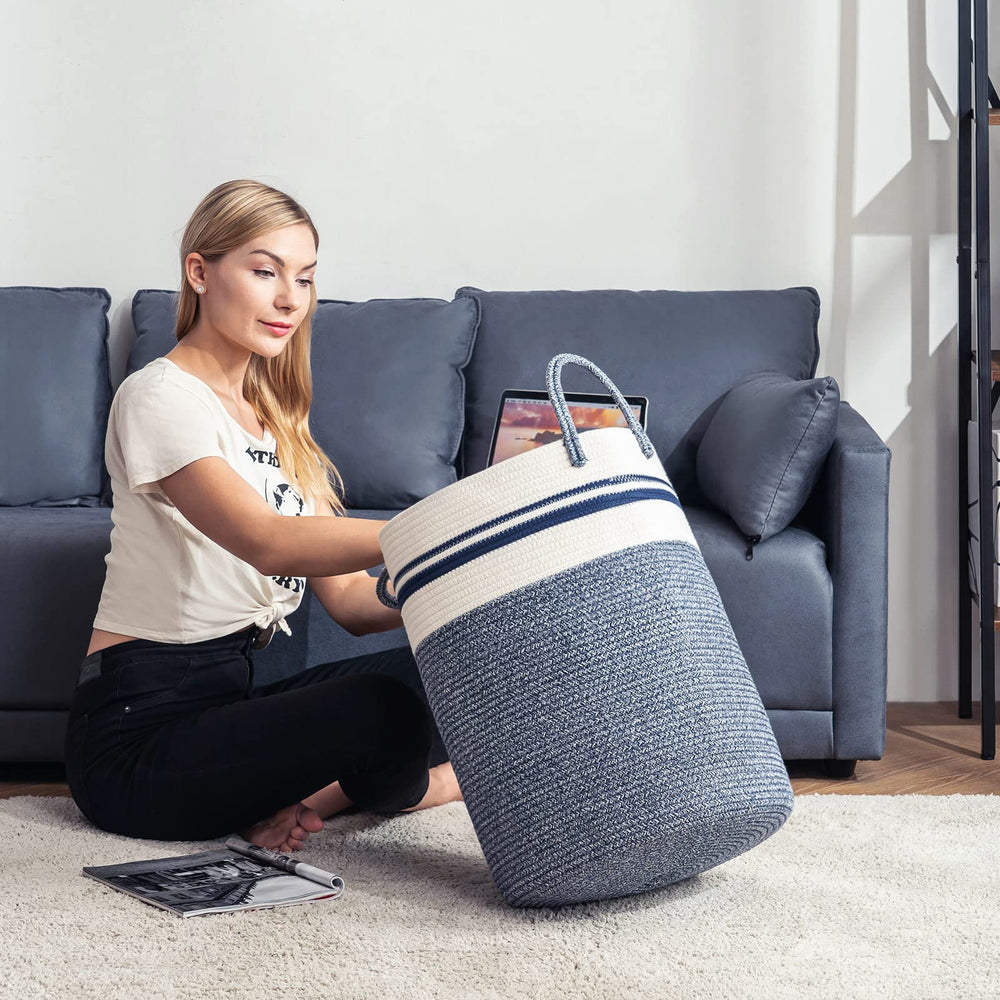 YOUDENOVA tall blue hamper full of blankets demonstrates generous capacity