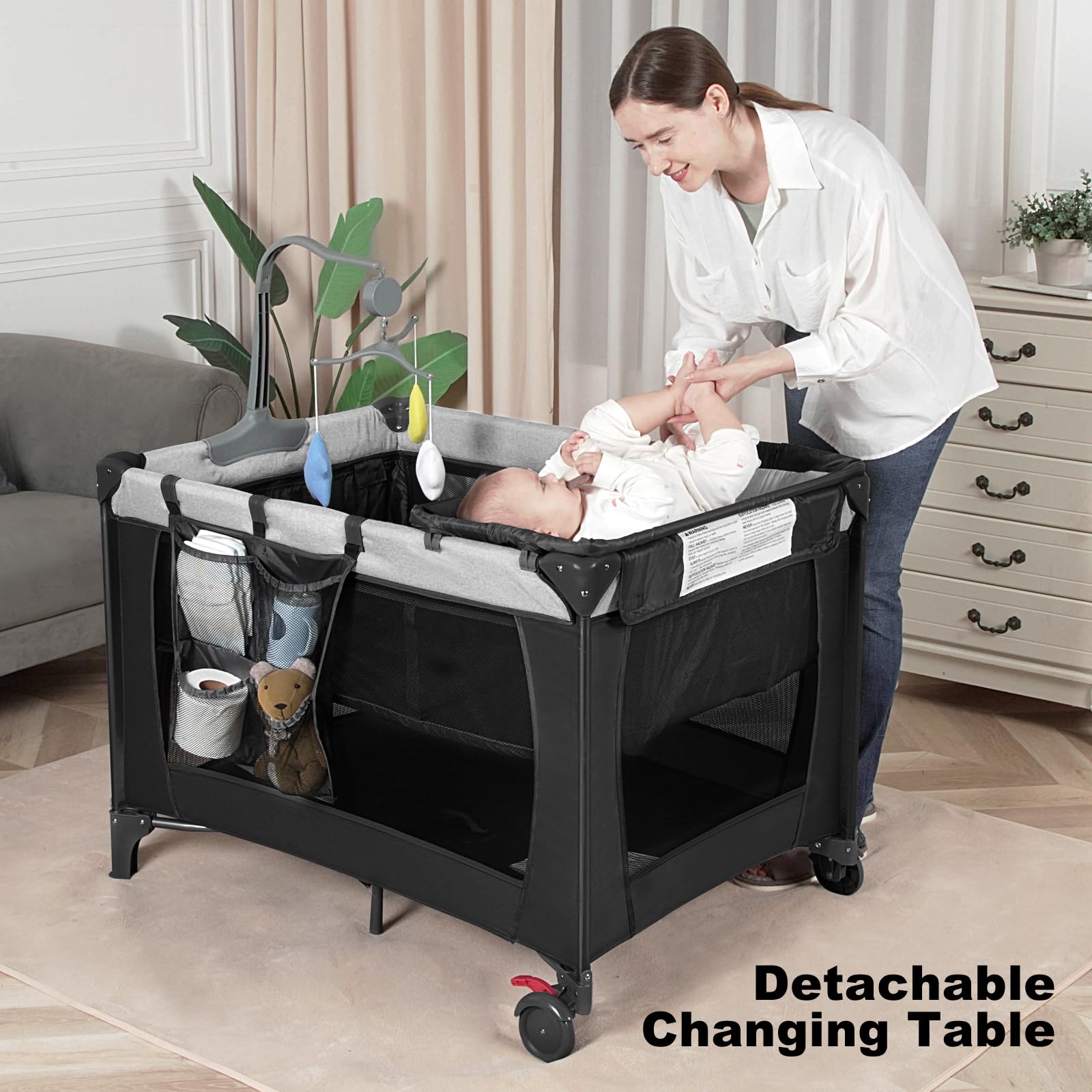 YoYiCuna travel crib folded in its carry bag showcases compact portability.