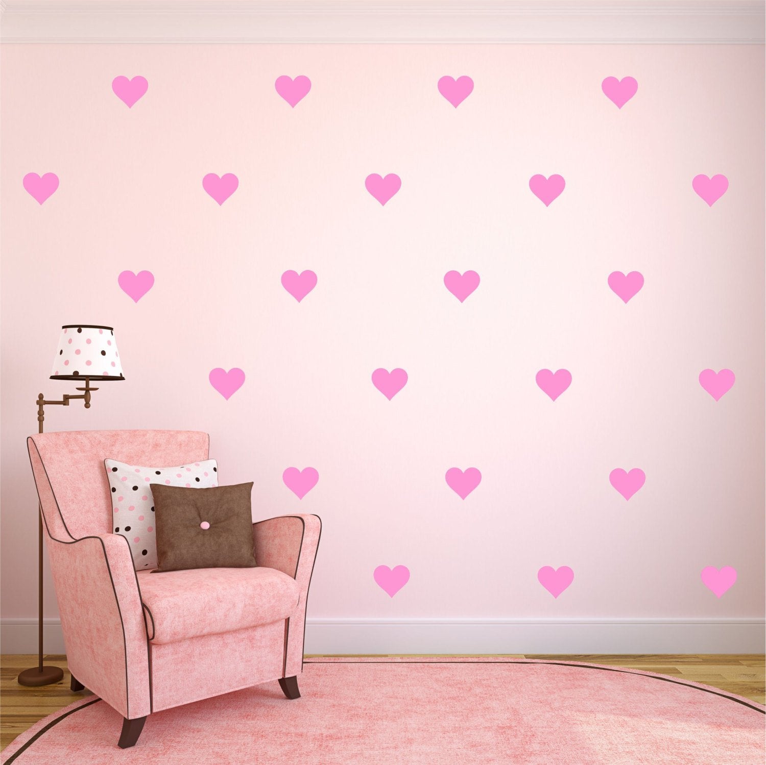 Removable 108-piece heart wall decals in soft pink for smooth surfaces.