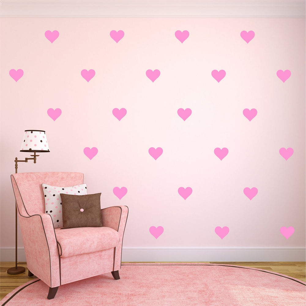 Removable 108-piece heart wall decals in soft pink for smooth surfaces.