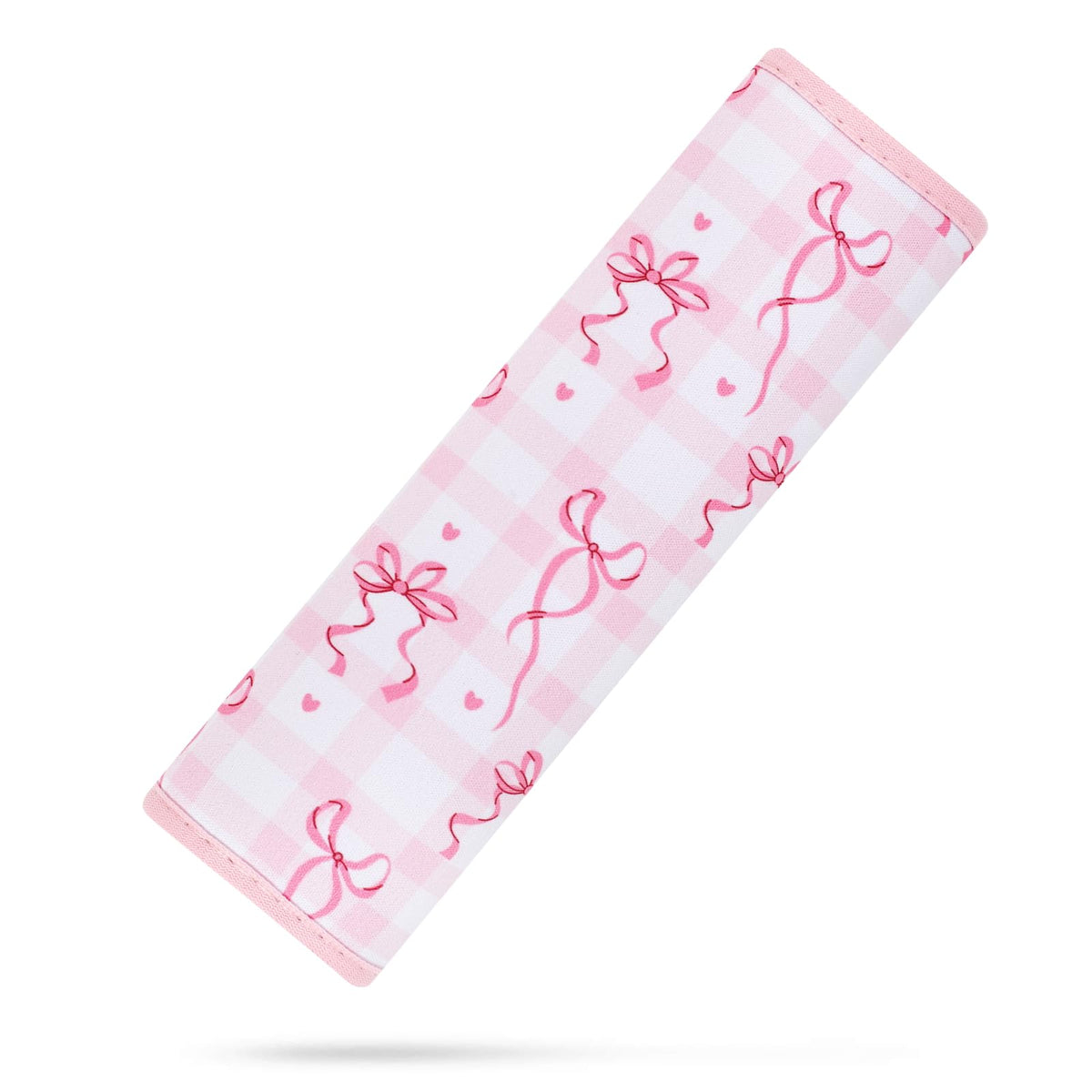 YR seat belt cover in pink bows cushions kids during car rides.
