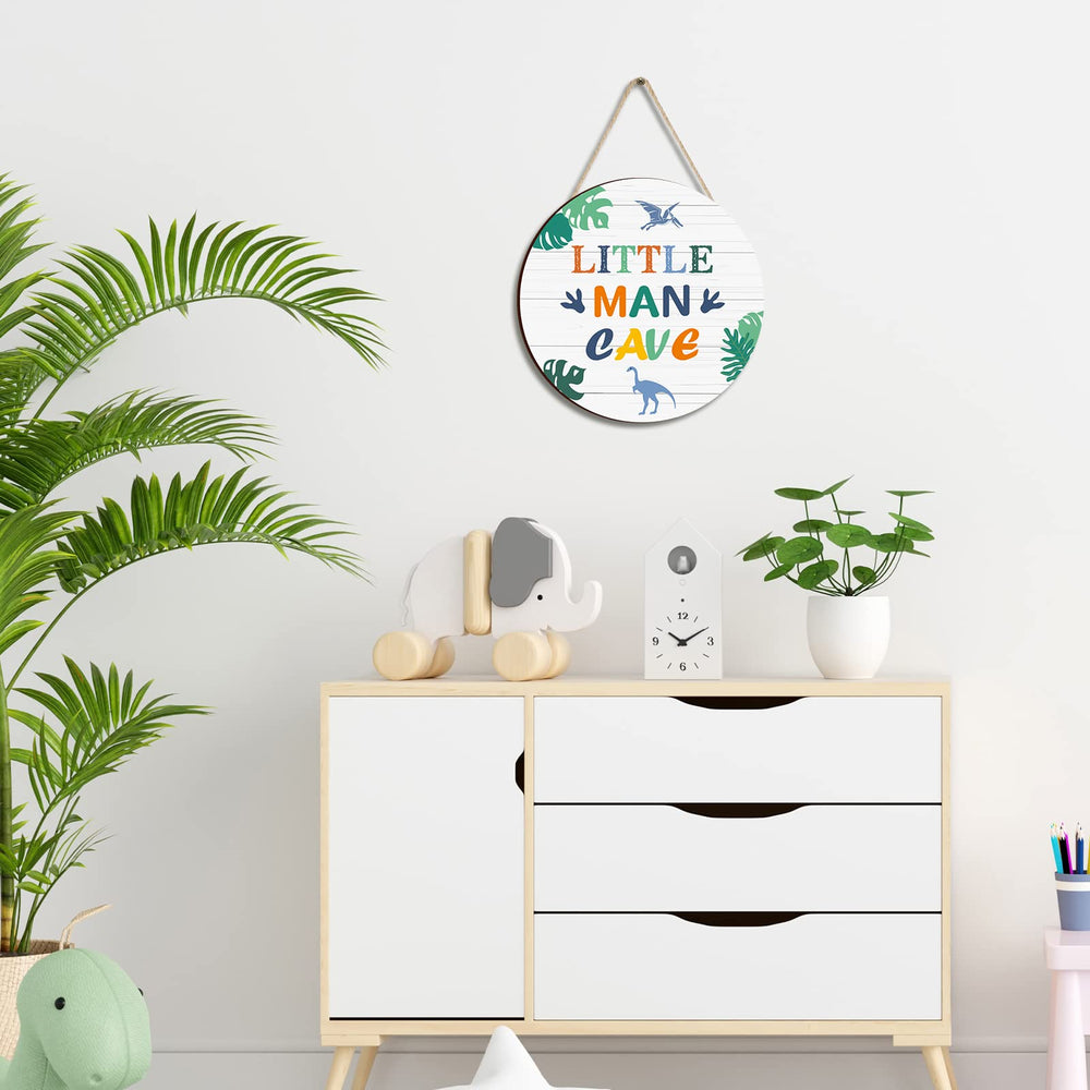 Yulejo nursery wall art features bright dinosaurs and bold text.