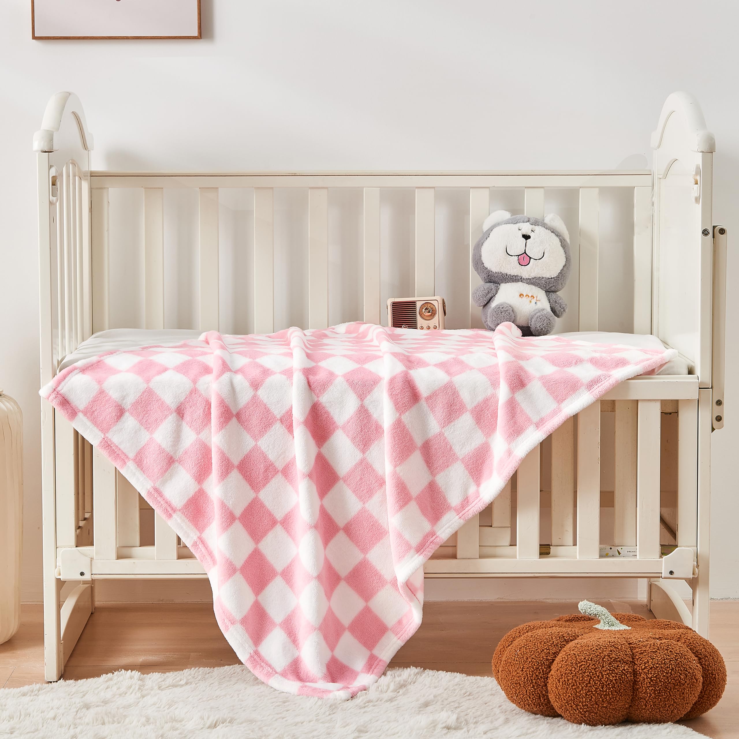 Yurhap pink checkered baby blanket travel-compact, ideal for on-the-go warmth.