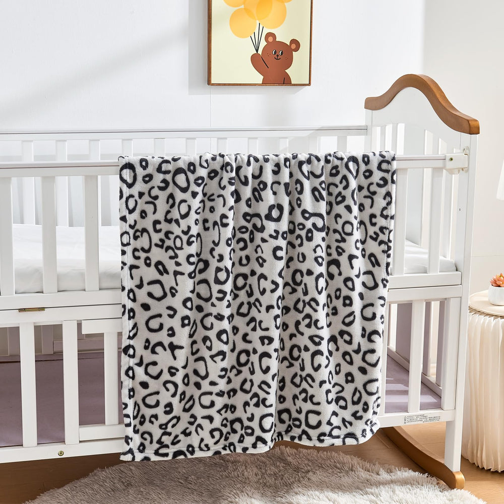 Yurhap leopard print baby blanket final use as a cozy travel throw for families.