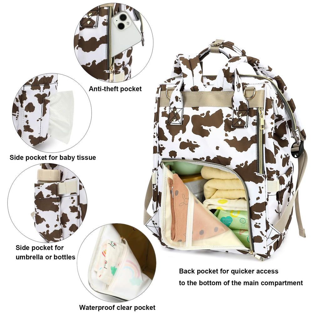 Yusudan cow print diaper bag interior organized compartments for bottles and wipes.