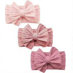 YWAOAIJD baby bow headbands in three mixed pink colors for stylish outfits.