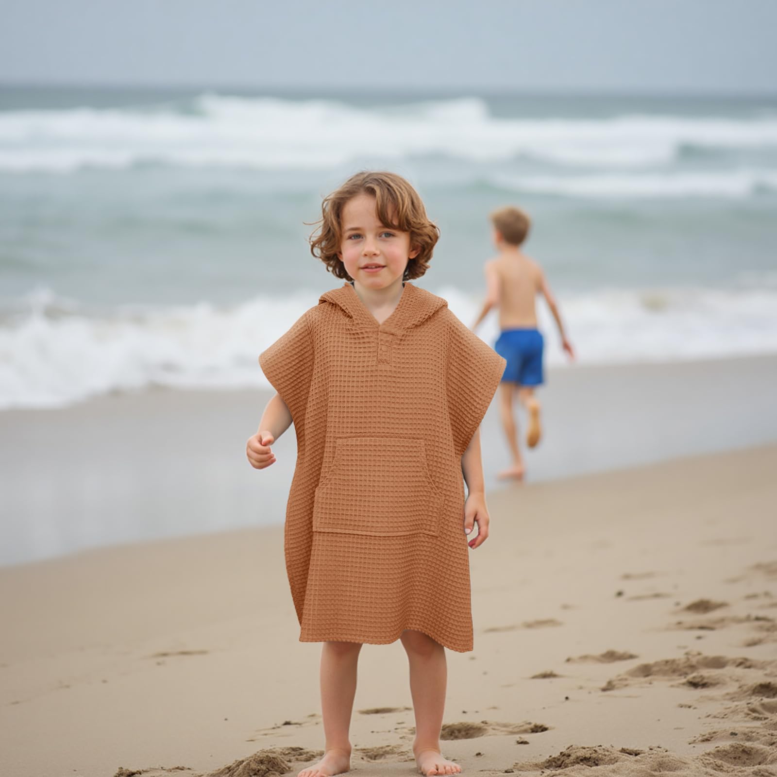 Kids at the beach wearing Zamlory hooded towel cover-up