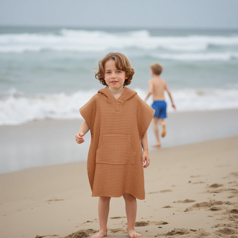 Kids at the beach wearing Zamlory hooded towel cover-up