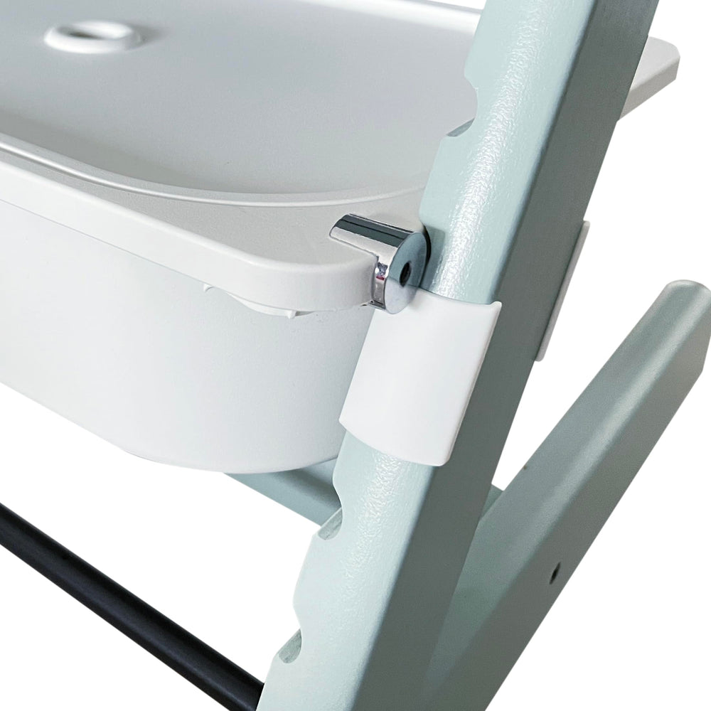 ZARPMA adapter shown with Stokke Tripp Trapp high chair for secure under-seat attachment.