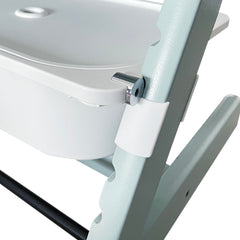 ZARPMA adapter shown with Stokke Tripp Trapp high chair for secure under-seat attachment.