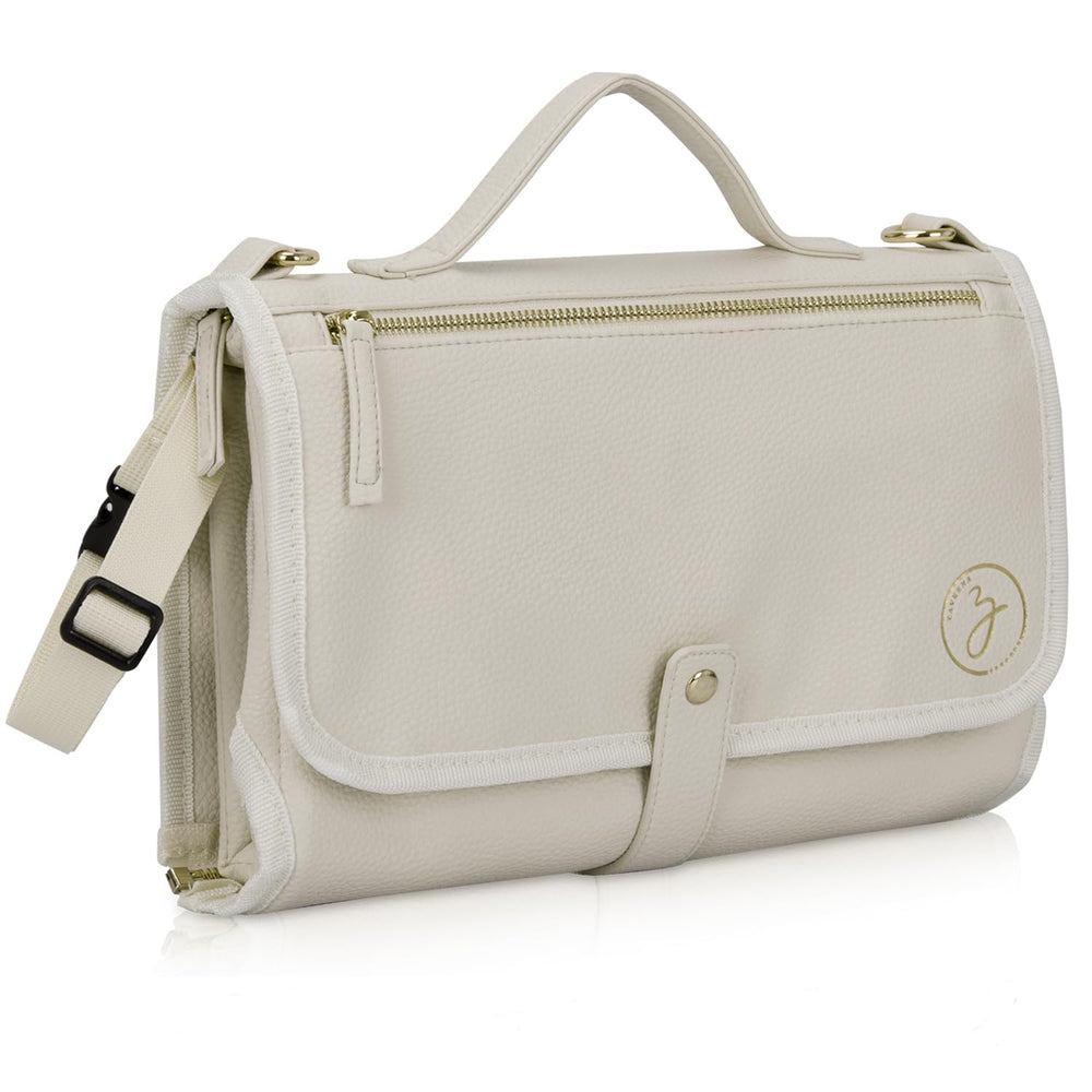 Zaveena portable diaper changing pad in cream exterior for stylish on-the-go changes.