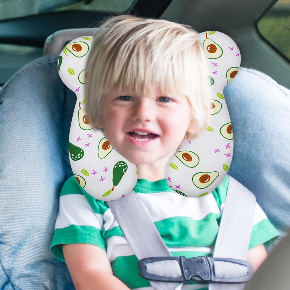 ZHOMA Avocado travel pillow attached to a stroller for on-the-go naps