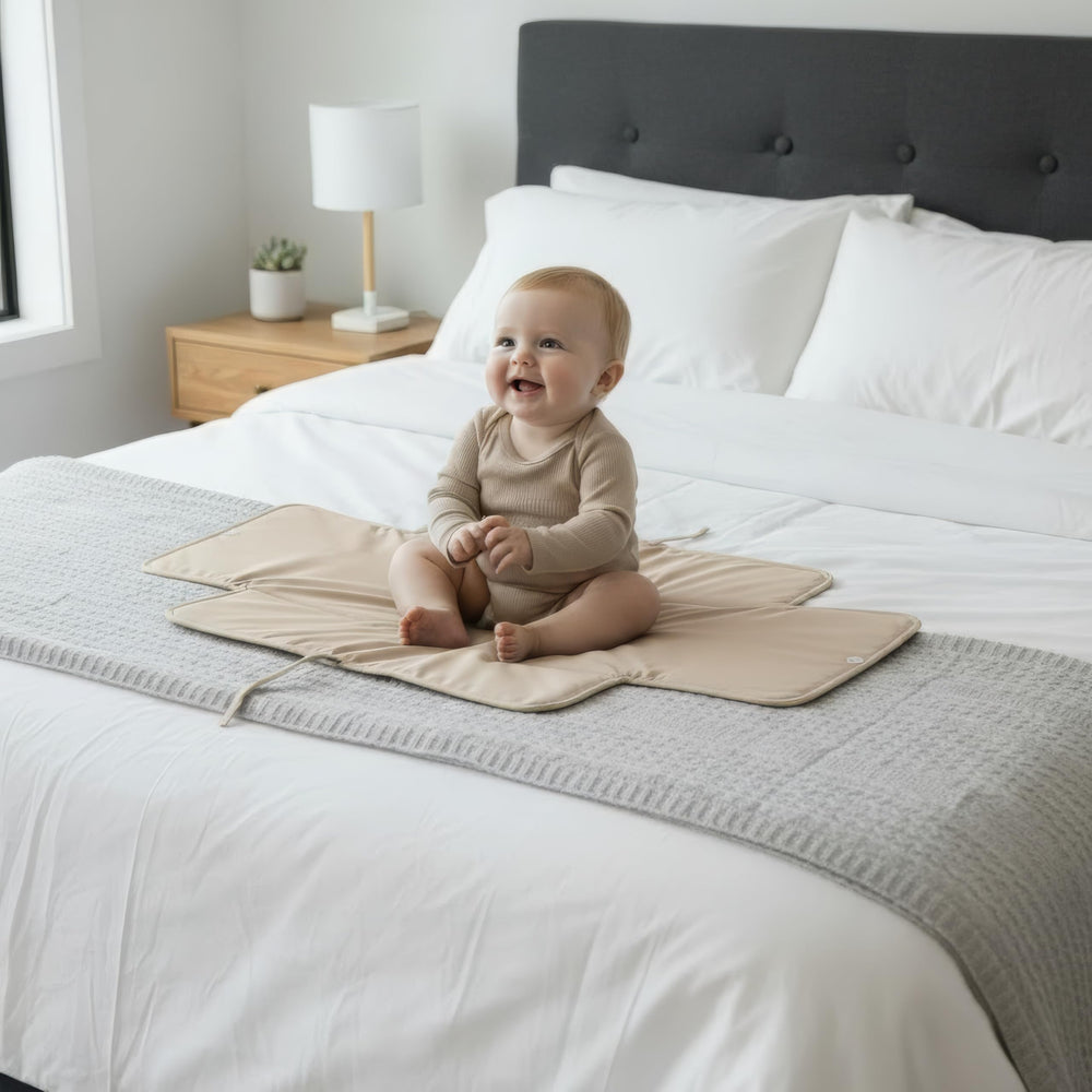 Elastic band on ZICOTO pad secures it in a diaper bag or organizer
