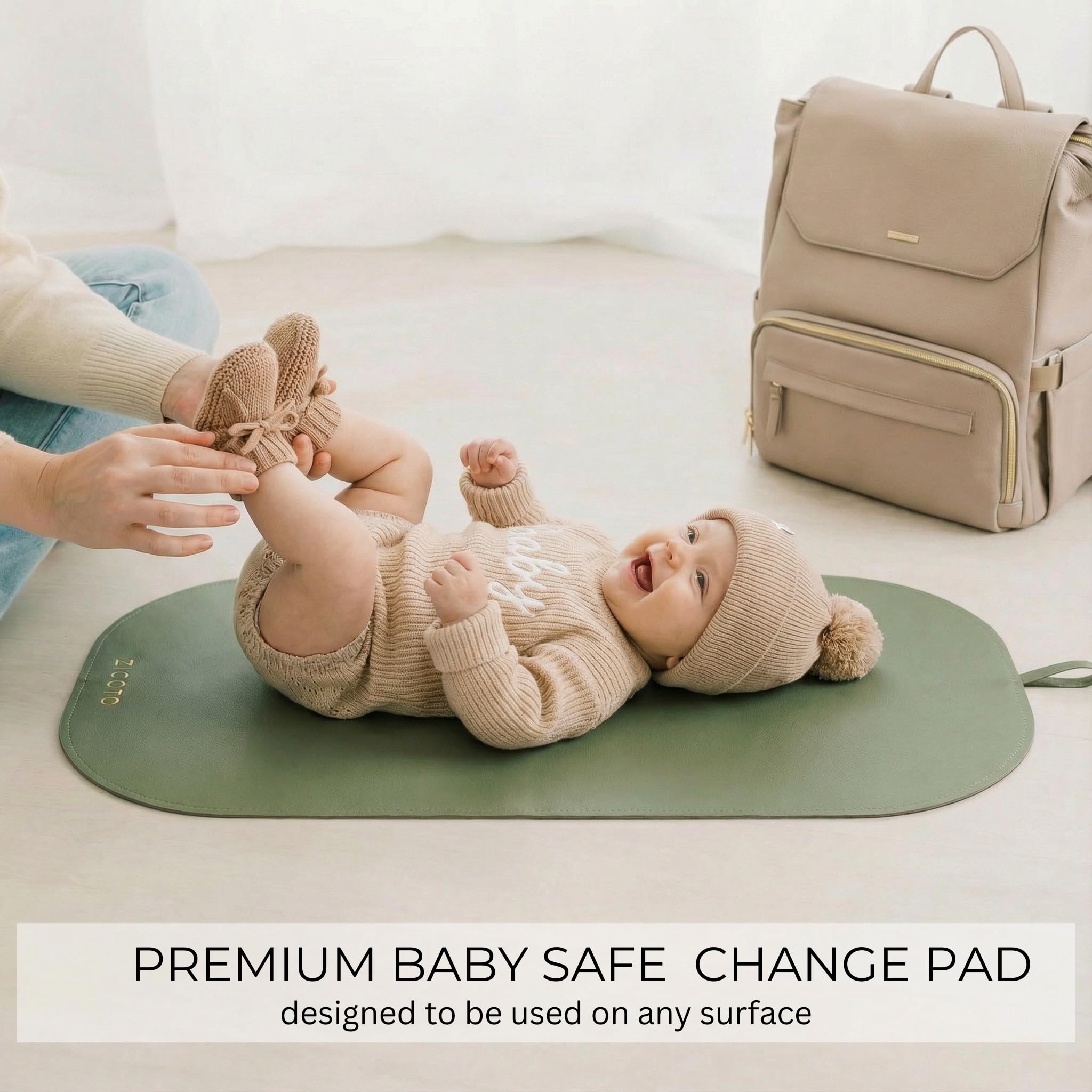 ZICOTO foldable diaper pad secured with elastic band in bag