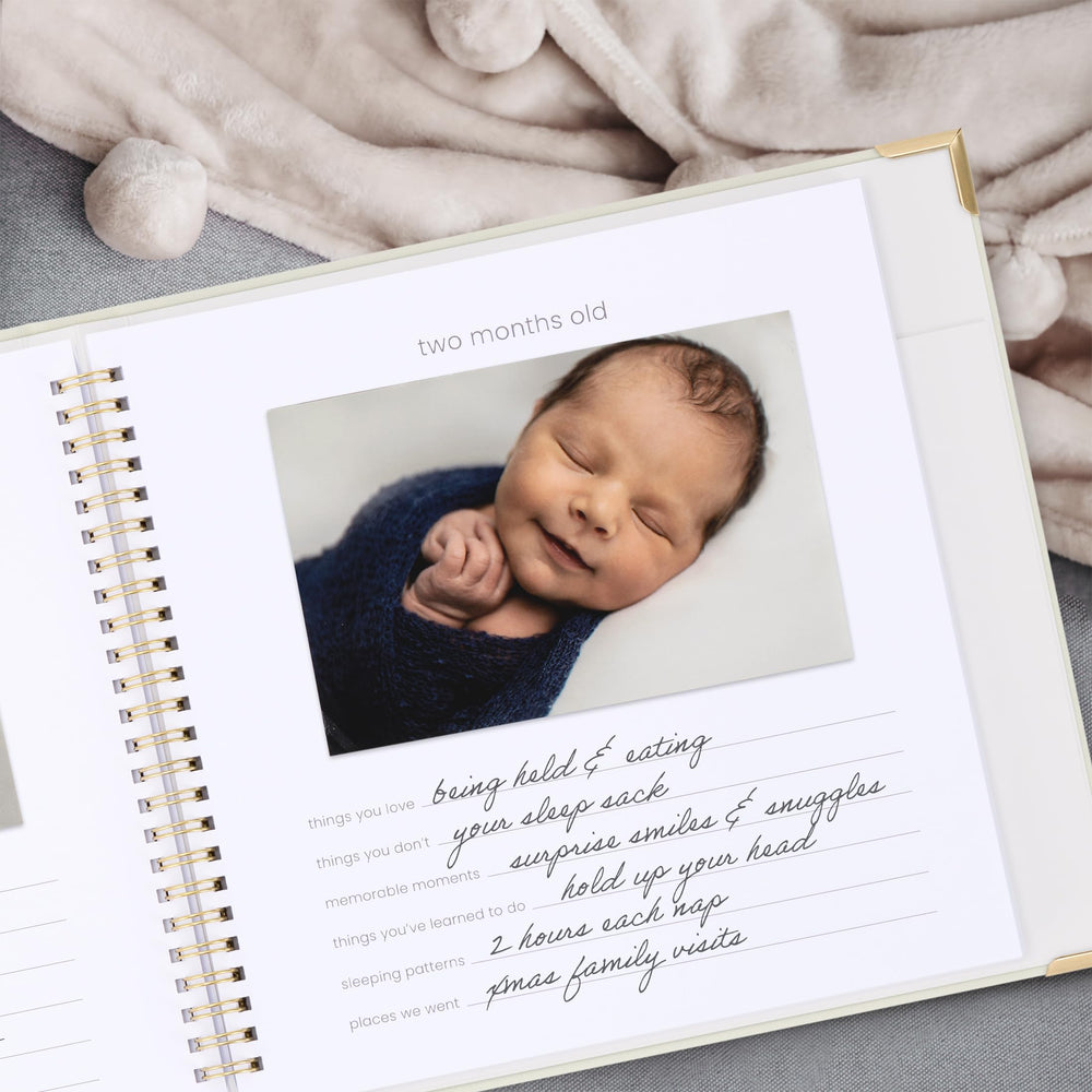 ZICOTO memory book interior pages with milestone prompts and photo slots