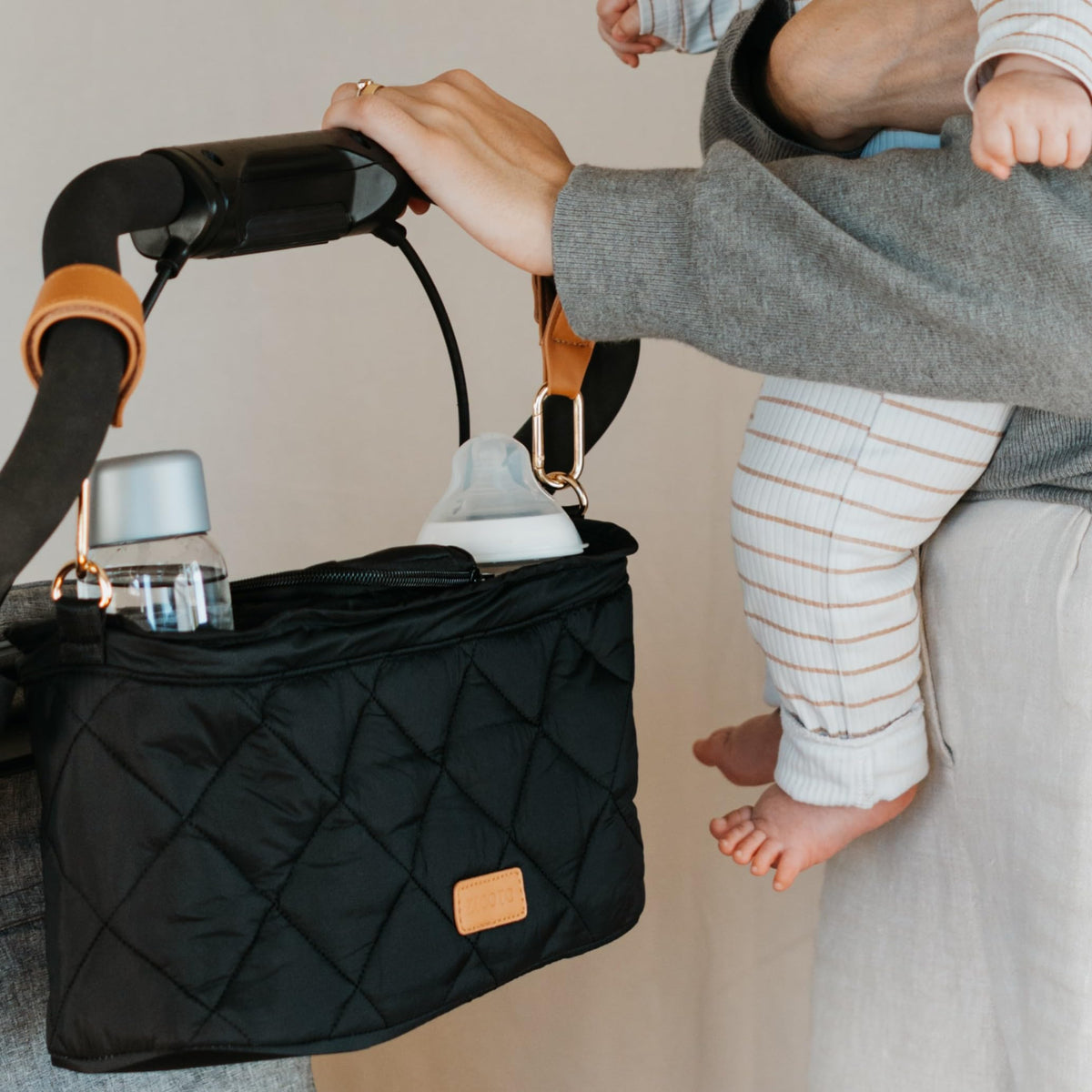 ZICOTO stroller organizer with two cup holders for easy bottle access.