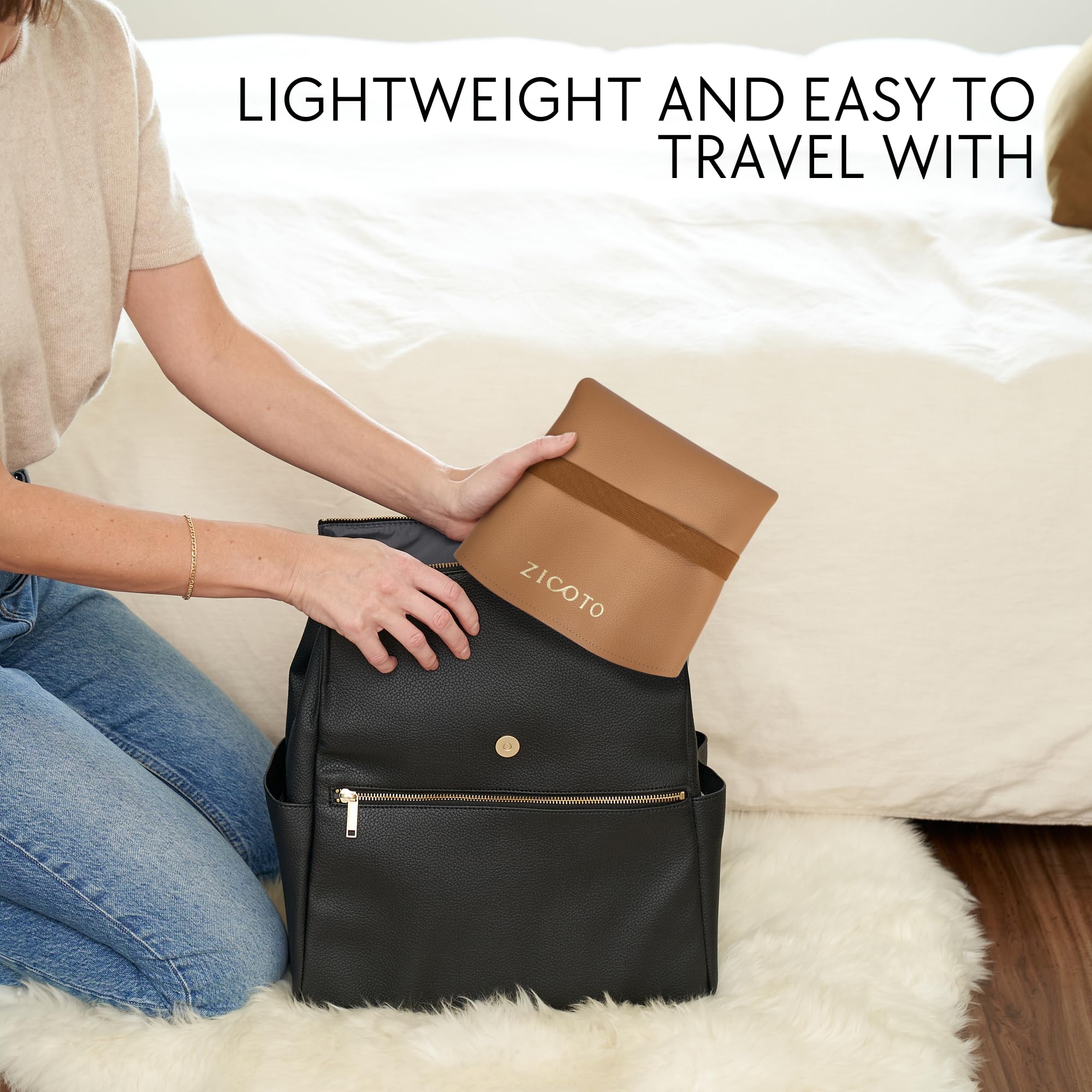 ZICOTO changing pad uses waterproof vegan leather for quick wipe-clean surfaces on travel.