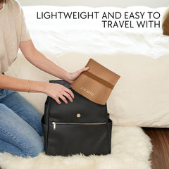 ZICOTO changing pad uses waterproof vegan leather for quick wipe-clean surfaces on travel.