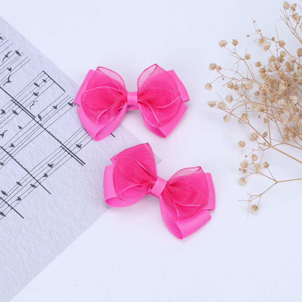 Zolyco deep pink bow clips coordinate with dresses and uniforms.