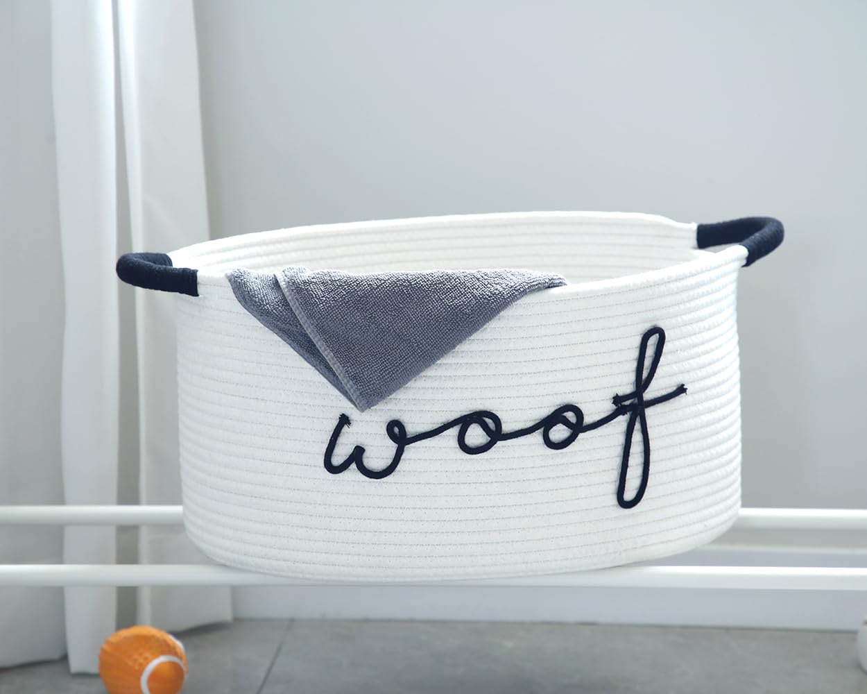 ZOMBATI Woof dog toy basket with side handles for easy carrying.