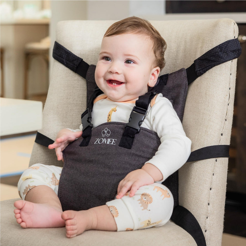 Zomee travel highchair universal fit secures seating on most chairs.