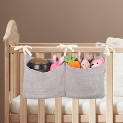 zonBroth bed-side hanging bag two pockets keeps diapers within reach.