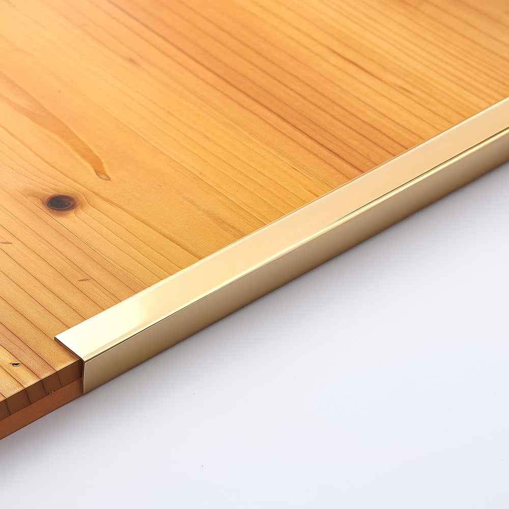 Zonon corner guard closeup reveals the elegant gold tone and precise fit.